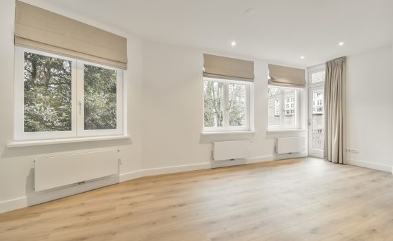 A large room in an empty new house