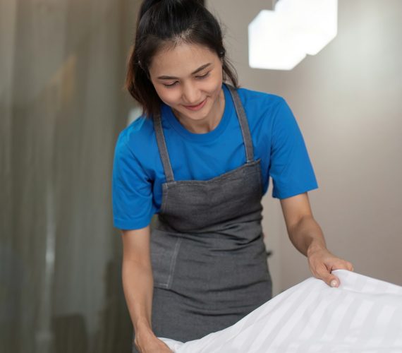 A woman asian staff cleaning service, tool and bucket for work. a young female cleaner with