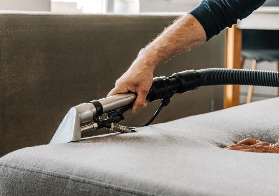Professional cleaning service deep cleaning sofa at home.